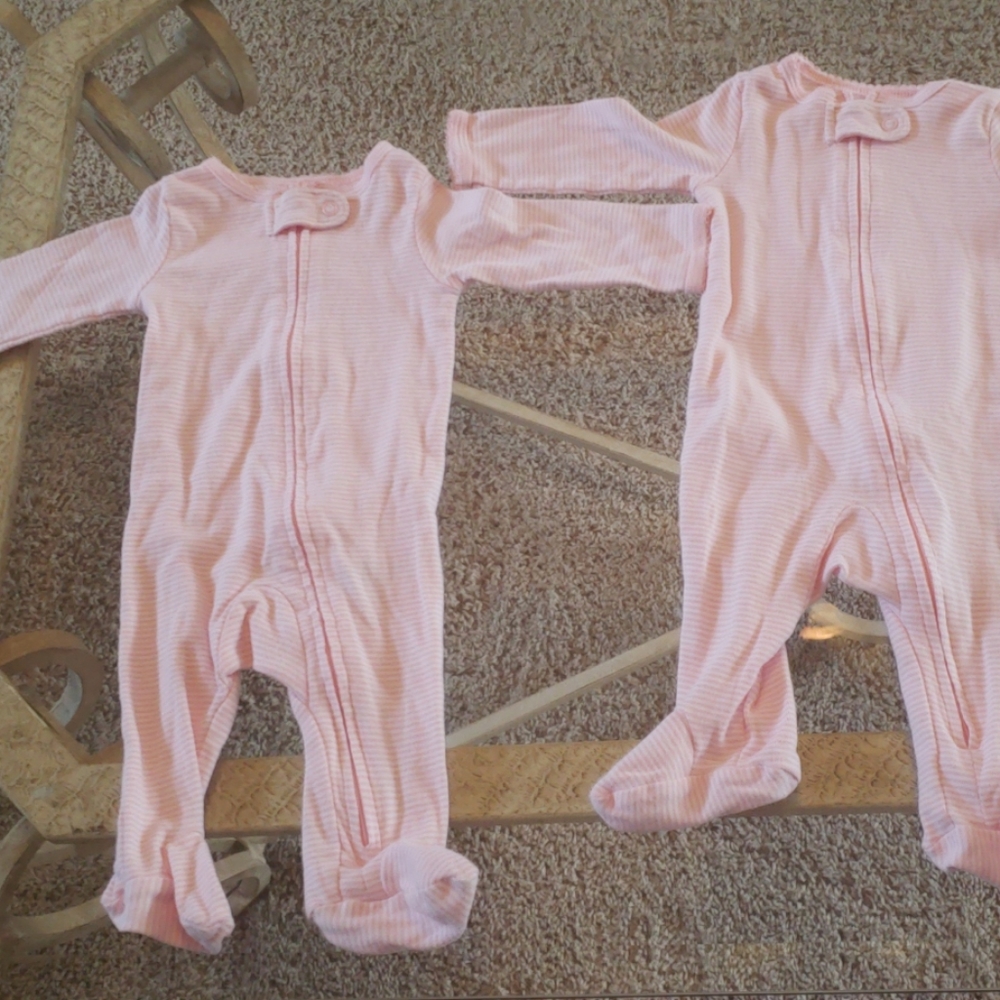 Two pink and white striped footed pajamas